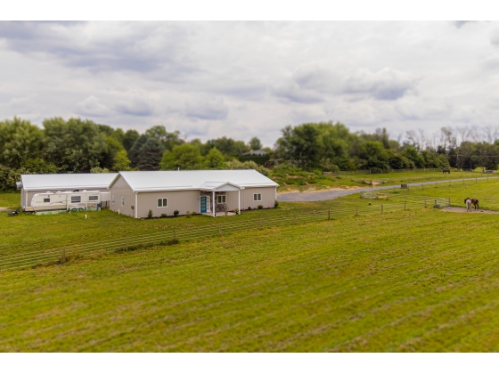 Turn-key horse property on 13.5 acres, stylish home & 14 stall barn